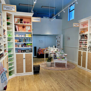 Interior with ofrenda behind vintage candy dishes